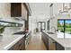 Bright, open kitchen with stainless steel appliances, sleek countertops, and access to the dining area at 1733 Harmon Ave, Winter Park, FL 32789