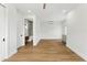 Spacious living room with wood floors, adjacent bathroom and kitchenette at 1733 Harmon Ave, Winter Park, FL 32789