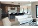 Open concept living room featuring sleek furniture, modern lighting, and wood flooring at 1733 Harmon Ave, Winter Park, FL 32789
