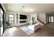 Bright and airy living room with hardwood floors, modern fireplace, stylish decor, and staircase access at 1733 Harmon Ave, Winter Park, FL 32789