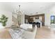 Open-concept living and dining area with modern lighting and kitchen at 1733 Harmon Ave, Winter Park, FL 32789