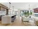 Open living space with a modern kitchen, dining, and living area with pool view at 1733 Harmon Ave, Winter Park, FL 32789