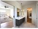 Bright main bathroom featuring a dual sink vanity, a sliding door to the main bedroom, and a walk-in closet at 1733 Harmon Ave, Winter Park, FL 32789