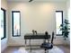 Bright home office featuring hardwood floors, large windows, a modern desk, and stylish decor at 1733 Harmon Ave, Winter Park, FL 32789