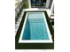 Overhead view of the pool featuring artificial turf and concrete surround at 1733 Harmon Ave, Winter Park, FL 32789