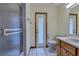 Bathroom featuring a vanity, toilet, shower, and a glass door to outside at 1879 Odham Dr, Deltona, FL 32738