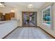 Bright dining area featuring tile floors and sliding door access to the enclosed patio at 1879 Odham Dr, Deltona, FL 32738