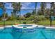 Close-up of a beautiful in-ground spa with tile detail, inside of screened pool enclosure at 1879 Odham Dr, Deltona, FL 32738