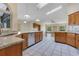 Open kitchen with granite countertops, stainless steel appliances, and skylights at 1879 Odham Dr, Deltona, FL 32738