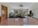 Inviting living room with hardwood floors, neutral walls, and a ceiling fan at 1879 Odham Dr, Deltona, FL 32738