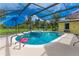 A sparkling in-ground pool features a built-in spa and a sunny patio area at 1879 Odham Dr, Deltona, FL 32738