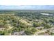 A sunny aerial neighborhood view filled with mature trees and various single-Gathering homes at 1921 Heathwood Dr, Winter Park, FL 32792