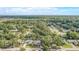 An aerial view of the neighborhood surrounded by lush greenery offering a serene and picturesque setting at 1921 Heathwood Dr, Winter Park, FL 32792