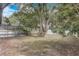 The mature landscaping of this backyard features a screened in pool making it a haven for relaxation and outdoor enjoyment at 1921 Heathwood Dr, Winter Park, FL 32792