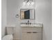 This half bath features a modern sink and a bright and airy feel at 1921 Heathwood Dr, Winter Park, FL 32792