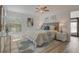 Bright bedroom with light-colored walls, a window, and a stylish area rug at 1921 Heathwood Dr, Winter Park, FL 32792
