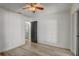Bedroom featuring light wood flooring, neutral walls, and a ceiling fan at 1921 Heathwood Dr, Winter Park, FL 32792