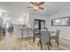 Bright dining area with wood floors, modern furniture, and lots of natural light through the sliding glass doors at 1921 Heathwood Dr, Winter Park, FL 32792