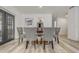 Dining area showcasing hardwood flooring, modern table with seating, and access to the outdoors at 1921 Heathwood Dr, Winter Park, FL 32792