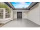 Inviting covered entry featuring double doors, textured walls, tiled floors, and natural light at 1921 Heathwood Dr, Winter Park, FL 32792