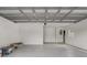 Spacious garage with fresh paint and modern lighting, ready for your personal touch at 1921 Heathwood Dr, Winter Park, FL 32792
