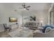 Cozy living room featuring neutral decor, plush seating, and abundant natural light at 1921 Heathwood Dr, Winter Park, FL 32792