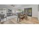 Open-concept living and dining area featuring lots of natural light and access to the pool at 1921 Heathwood Dr, Winter Park, FL 32792