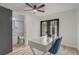 Bright office with a desk, glass doors to the exterior, and an ensuite bathroom with stylish finishes at 1921 Heathwood Dr, Winter Park, FL 32792