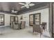 Screened patio with ceiling fans and a table for entertaining and relaxation at 1921 Heathwood Dr, Winter Park, FL 32792