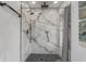 This gorgeous black and white shower boasts a luxury shower head and custom tile work at 1921 Heathwood Dr, Winter Park, FL 32792