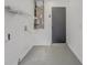 Additional storage space available in the garage, complete with shelving and utility hookups at 1921 Heathwood Dr, Winter Park, FL 32792