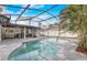 Beautiful screened-in pool with clear blue water and lush landscaping, perfect for relaxing and entertaining at 1921 Heathwood Dr, Winter Park, FL 32792