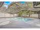 Screened-in pool surrounded by tropical landscaping offers a private backyard oasis for relaxation and recreation at 1921 Heathwood Dr, Winter Park, FL 32792