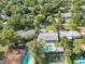 Aerial view of the home showcasing the pool, landscaping, and fenced backyard at 1926 Natalen Rd, Winter Park, FL 32792