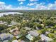 Aerial view of the neighborhood, lush landscaping, lakes, and the surrounding area at 1926 Natalen Rd, Winter Park, FL 32792