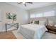 Comfortable bedroom with a plush bed, modern decor, and plenty of natural light at 1926 Natalen Rd, Winter Park, FL 32792