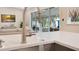 Modern kitchen featuring a stainless steel faucet and a view of the outside living area at 1926 Natalen Rd, Winter Park, FL 32792