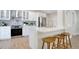 Well-appointed kitchen showcasing stainless steel appliances, white cabinetry, and contemporary tile backsplash at 1926 Natalen Rd, Winter Park, FL 32792