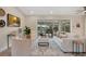 Bright and airy living room with comfortable seating, sliding glass doors, and a view of the refreshing pool at 1926 Natalen Rd, Winter Park, FL 32792