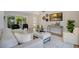 Open-concept living room boasting modern decor, hardwood floors, and a seamless indoor-outdoor flow at 1926 Natalen Rd, Winter Park, FL 32792
