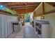 Covered outdoor kitchen with grill, counter space, and storage at 1926 Natalen Rd, Winter Park, FL 32792