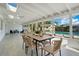 Enclosed porch features dining area and overlooks the pool at 1926 Natalen Rd, Winter Park, FL 32792