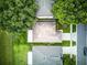Aerial view of rooftops with mature trees in a well-maintained neighborhood at 2031 Wekiva Reserve Blvd, Apopka, FL 32703