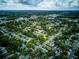 Scenic aerial shot showcases the neighborhood's neatly arranged streets, verdant canopy, and cozy homes in a tranquil community setting at 2031 Wekiva Reserve Blvd, Apopka, FL 32703