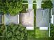 Aerial view of rooftops with mature trees in a well-maintained neighborhood at 2031 Wekiva Reserve Blvd, Apopka, FL 32703