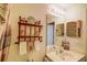 Bathroom featuring a sink and vanity, mirror, shelves, and a shower at 2031 Wekiva Reserve Blvd, Apopka, FL 32703