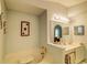 Bathroom with a large soaking tub, an elegant mirror, and recessed lighting at 2031 Wekiva Reserve Blvd, Apopka, FL 32703