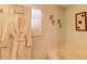Bathroom with a soaking tub, a robe hanging on the door, and decorative accents at 2031 Wekiva Reserve Blvd, Apopka, FL 32703