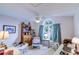 Cozy bedroom featuring a vaulted ceiling, a fan, and a window overlooking the outside greenery at 2031 Wekiva Reserve Blvd, Apopka, FL 32703