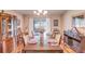 Dining room with a large table set for dinner and sliding glass doors to the patio at 2031 Wekiva Reserve Blvd, Apopka, FL 32703